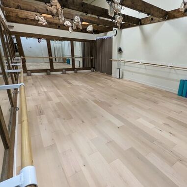 A modern room with maple hardwood flooring, illustrating its contemporary appeal and hardness.
