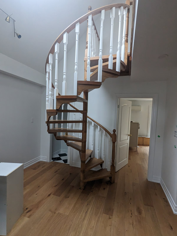 Engineered hardwood floors and staircase refinished in etobicoke