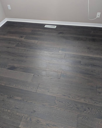 Dark-colored hardwood flooring providing a rich contrast in a room
