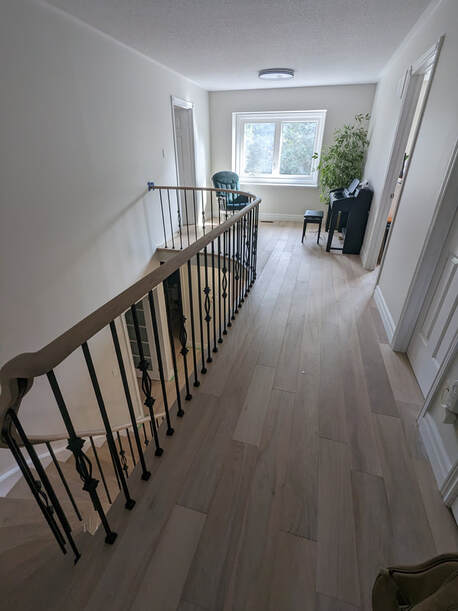 Elegant engineered hardwood flooring by Parqueteam Hardwood Flooring in a Toronto home.