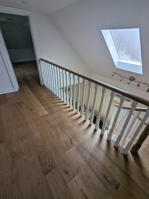 upper hallway with installed engineered hardwood floors